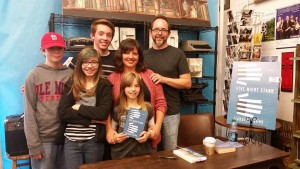 My family (L to R): Joshua, Somerset, Calvin, Kristy, Genevieve (holding the book), and me.